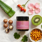 Pūraka Anti-Ageing Cream jar surrounded by natural ingredients including macadamia, rosehip, aloe vera and seabuckthorn