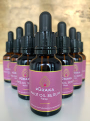 Multiple bottles of Pūraka Face Oil Serum Rose in amber glass dropper bottles, handmade in small batches in the United Kingdom