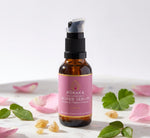 Pūraka Hydrating Super Serum with rose petals and frankincense resin on marble